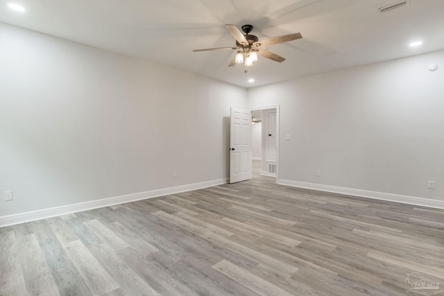 unfurnished room featuring ceiling fan and light hardwood / wood-style flooring