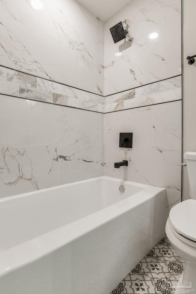 bathroom with toilet, tub / shower combination, and tile patterned floors