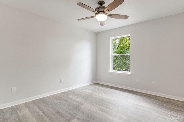 unfurnished room featuring light hardwood / wood-style floors and ceiling fan