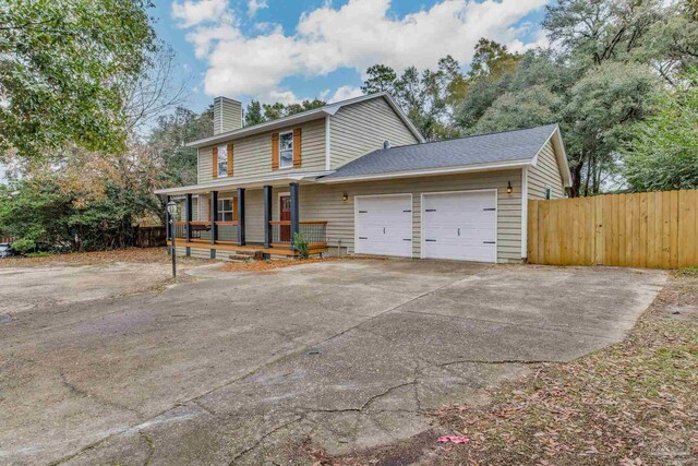 view of front of home featuring a garage and covered porch