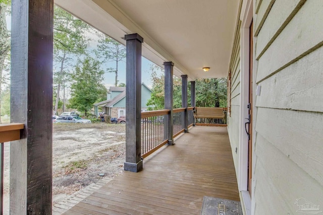 wooden terrace featuring a porch