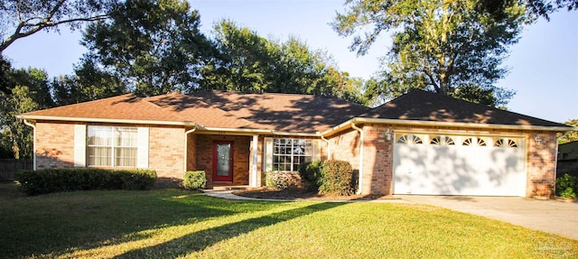 single story home featuring brick siding, driveway, an attached garage, and a front yard