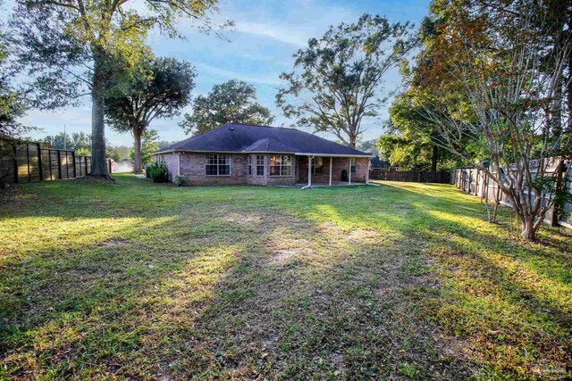 rear view of property featuring brick siding