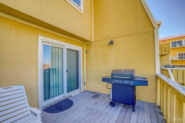 wooden deck featuring area for grilling