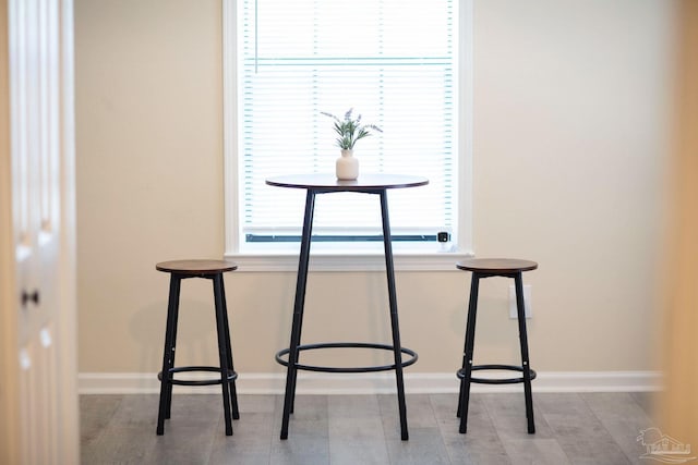 unfurnished dining area featuring baseboards