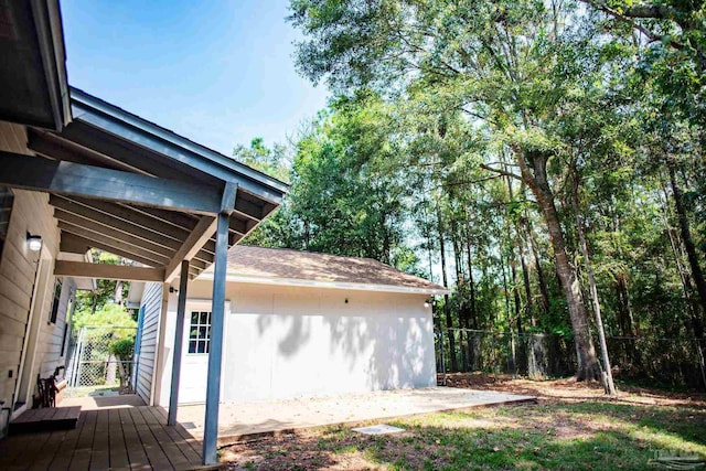 garage with fence