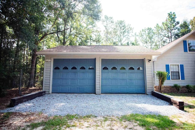 garage featuring fence