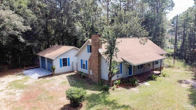 aerial view featuring a wooded view