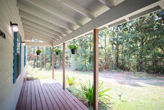 deck featuring a lawn