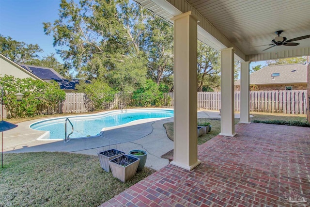 view of pool featuring a fenced in pool, a patio area, a fenced backyard, and ceiling fan