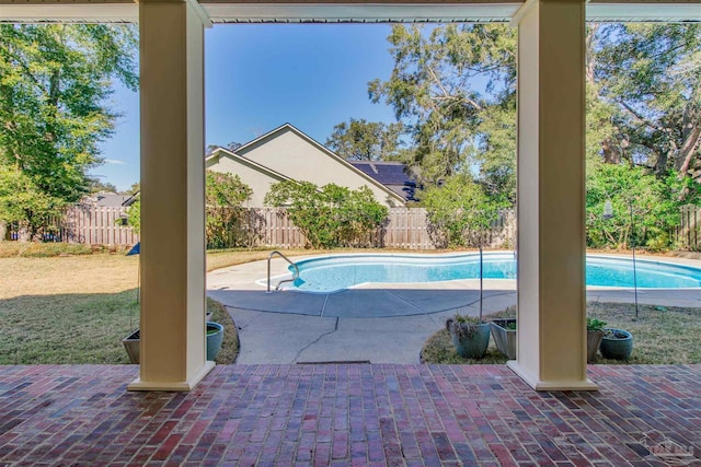 view of swimming pool featuring a fenced in pool, a patio area, and a fenced backyard