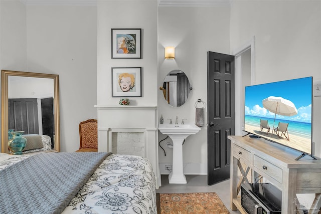 bedroom with sink and ornamental molding