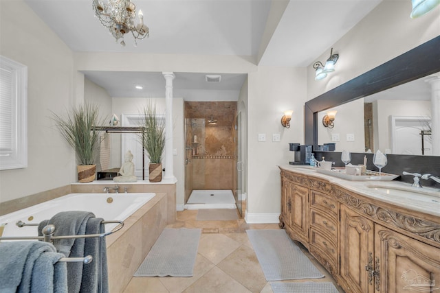 bathroom featuring vanity, an inviting chandelier, shower with separate bathtub, and decorative columns