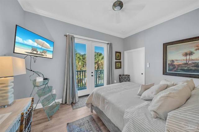 bedroom featuring french doors, light wood-type flooring, access to outside, and crown molding