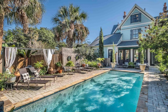 view of swimming pool with a patio area