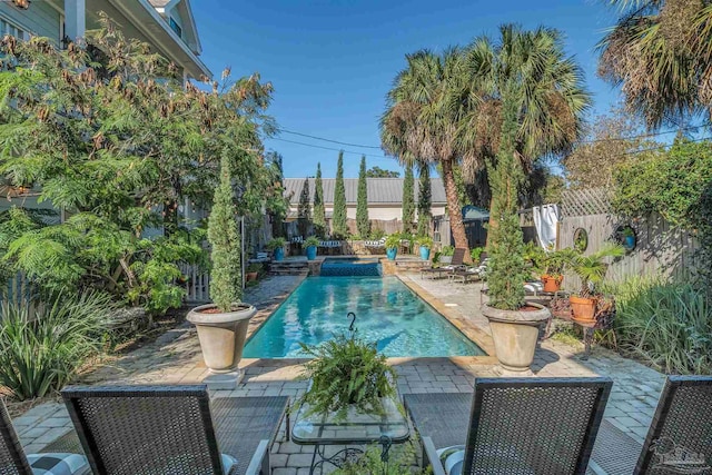 view of swimming pool featuring a patio area