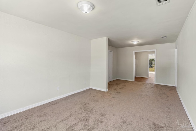 empty room with light colored carpet