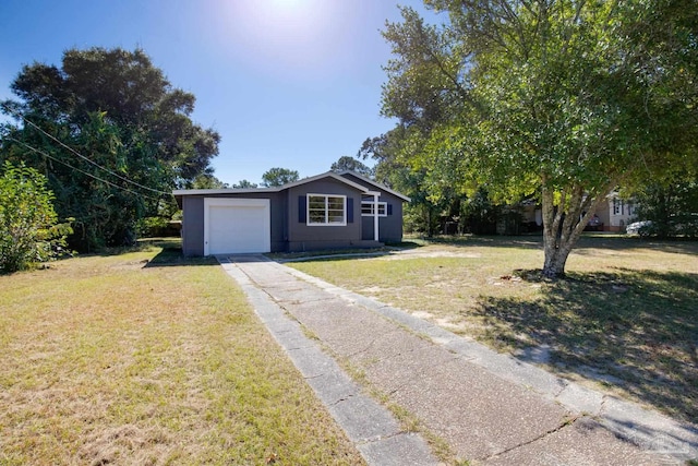 ranch-style home featuring a front yard and a garage