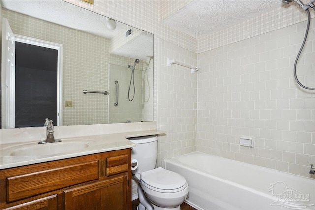 bathroom featuring shower / bath combination, a textured ceiling, toilet, and vanity