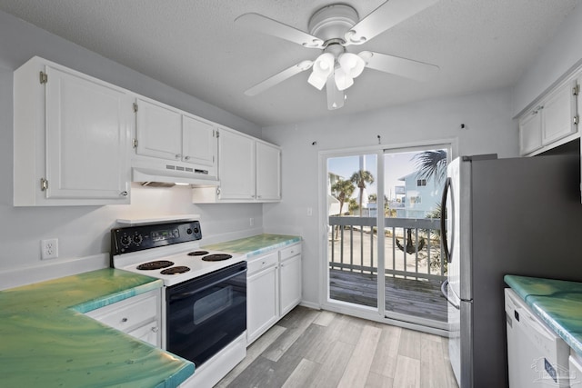 kitchen with stainless steel fridge, white electric range oven, a textured ceiling, ceiling fan, and white cabinets