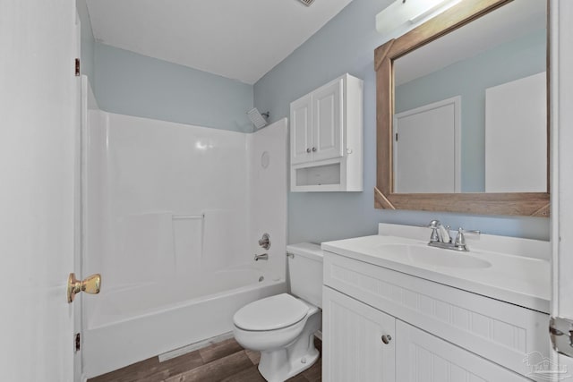 full bathroom featuring shower / tub combination, vanity, hardwood / wood-style flooring, and toilet