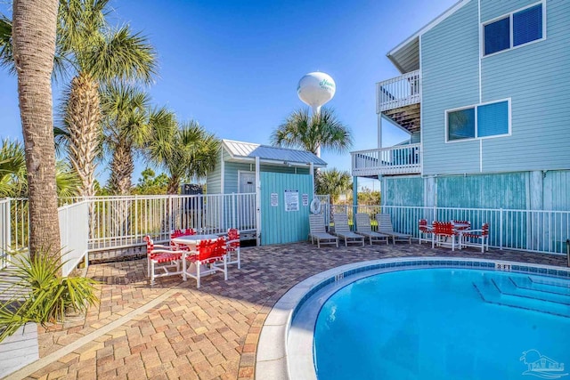 view of swimming pool featuring a patio area