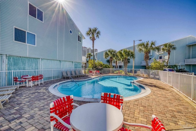 view of swimming pool featuring a patio