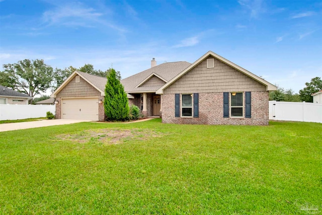 craftsman-style home featuring a front yard and a garage