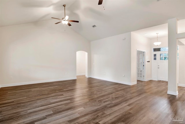 unfurnished living room featuring ceiling fan, dark hardwood / wood-style flooring, and high vaulted ceiling