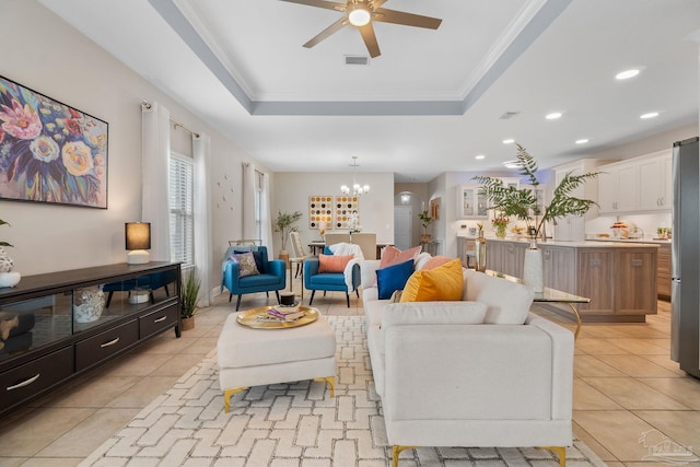 1777 Waterford Sound Blvd, Gulf Breeze, FL 32563 - living room with a ceiling fan, a tray ceiling, a chandelier, light tile patterned floors, and recessed lighting