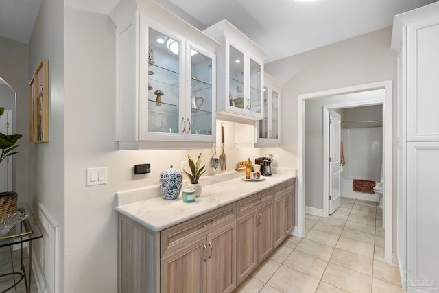 1777 Waterford Sound Blvd, Gulf Breeze, FL 32563 - bar area with light tile patterned floors and baseboards