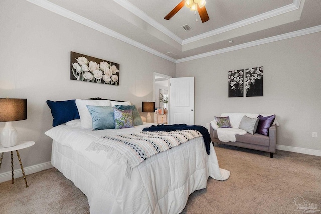 1777 Waterford Sound Blvd, Gulf Breeze, FL 32563 - carpeted bedroom featuring crown molding, a tray ceiling, baseboards, and a ceiling fan