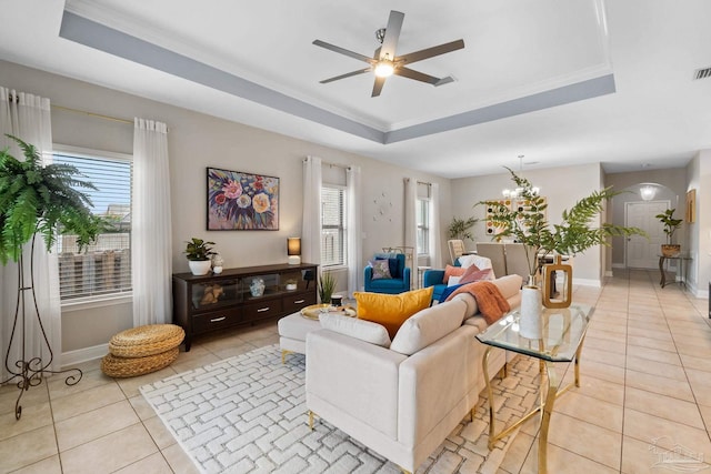 1777 Waterford Sound Blvd, Gulf Breeze, FL 32563 - living area featuring a raised ceiling, light tile patterned floors, ornamental molding, and plenty of natural light