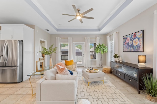 1777 Waterford Sound Blvd, Gulf Breeze, FL 32563 - living area featuring a raised ceiling, a ceiling fan, light tile patterned floors, and ornamental molding