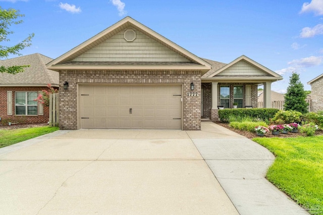 1777 Waterford Sound Blvd, Gulf Breeze, FL 32563 - view of front of property featuring brick siding, concrete driveway, and a garage