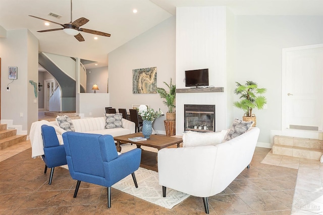 living room with high vaulted ceiling and ceiling fan