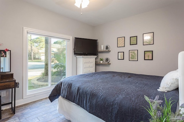 bedroom featuring ceiling fan and wood-type flooring