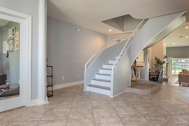 stairs with tile patterned flooring