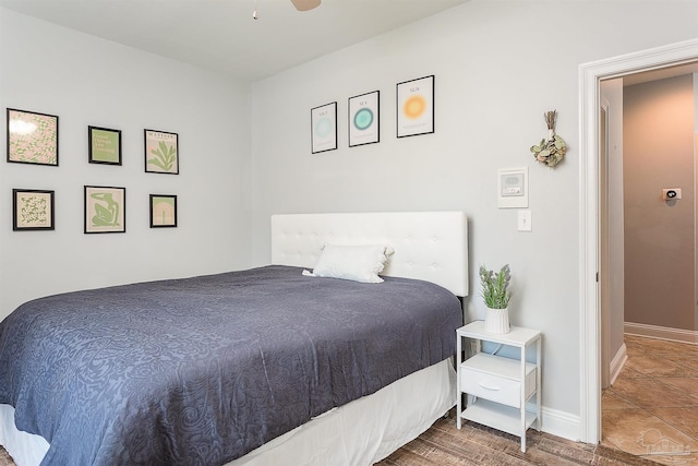 bedroom featuring hardwood / wood-style floors and ceiling fan