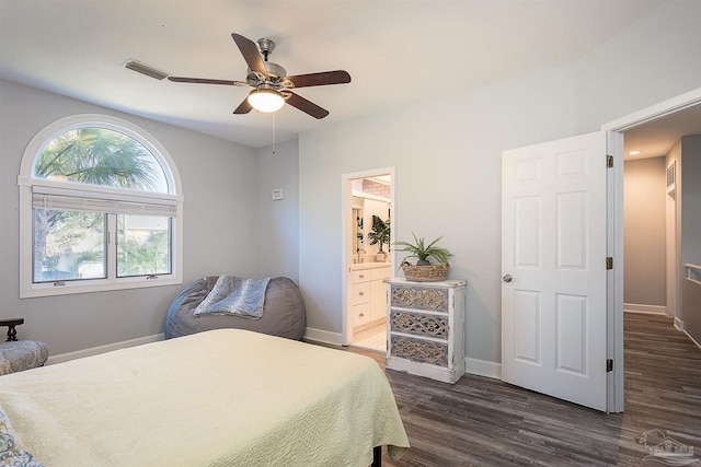 bedroom featuring ensuite bathroom, dark hardwood / wood-style flooring, and ceiling fan