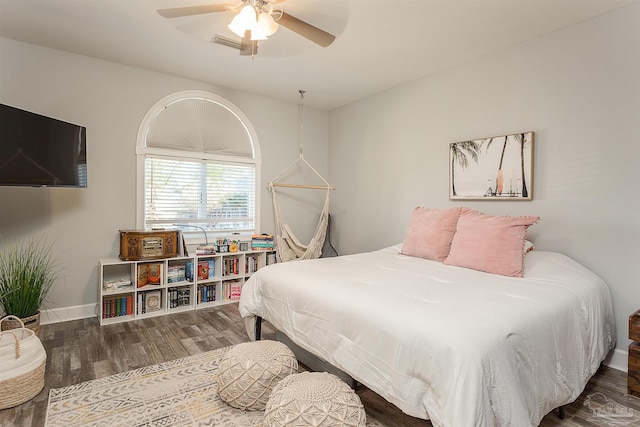 bedroom with ceiling fan and wood-type flooring