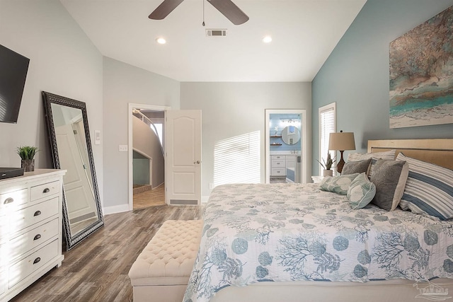 bedroom with connected bathroom, ceiling fan, dark wood-type flooring, and vaulted ceiling