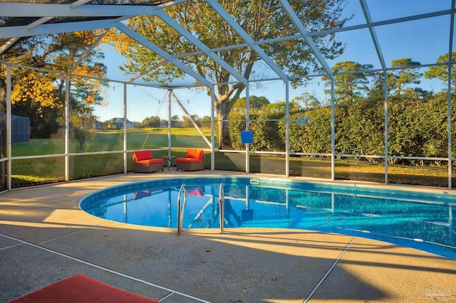 view of pool with a lanai and a patio area