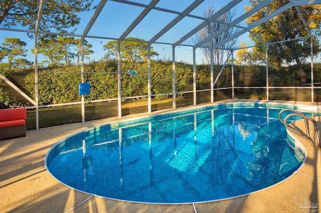 view of pool featuring a lanai and a patio