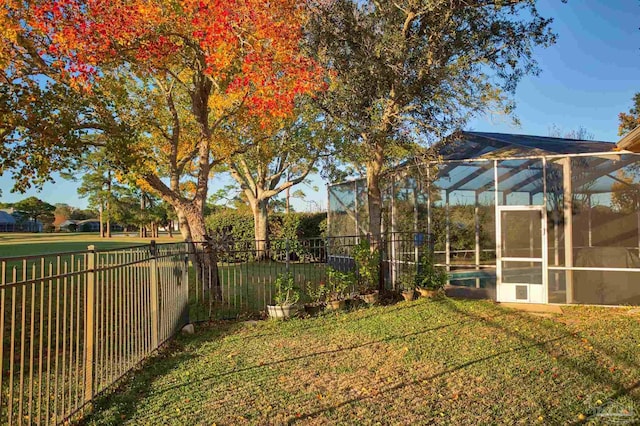 view of yard with a lanai