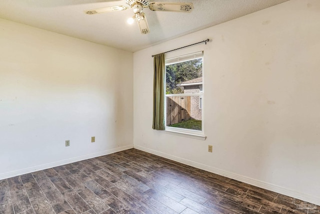 spare room featuring a textured ceiling, dark hardwood / wood-style flooring, and ceiling fan