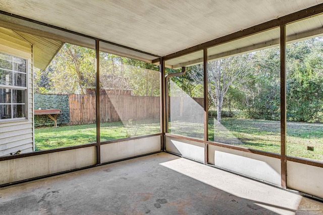 unfurnished sunroom featuring a wealth of natural light