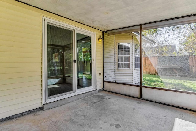 unfurnished sunroom with plenty of natural light