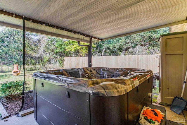 view of patio / terrace with a hot tub