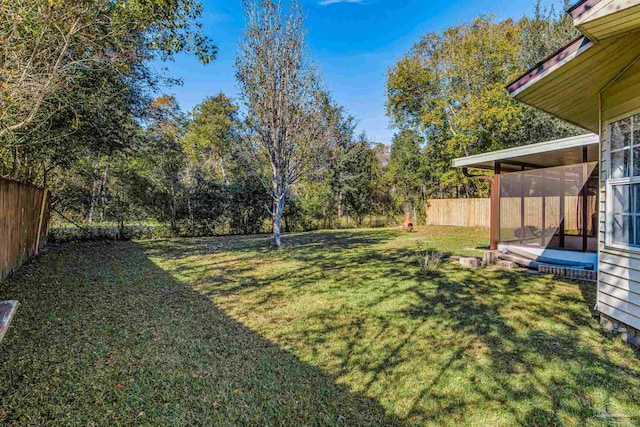 view of yard featuring a sunroom